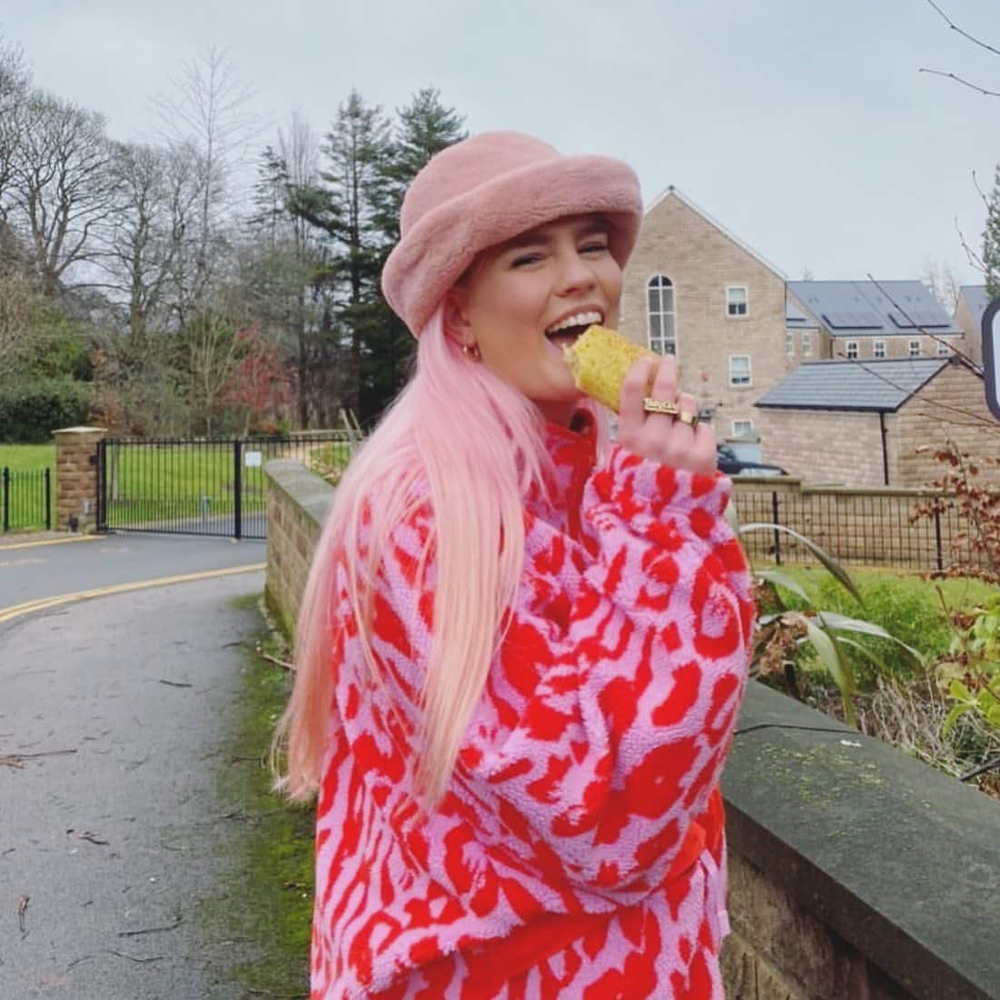 Girl in pink jacket eating