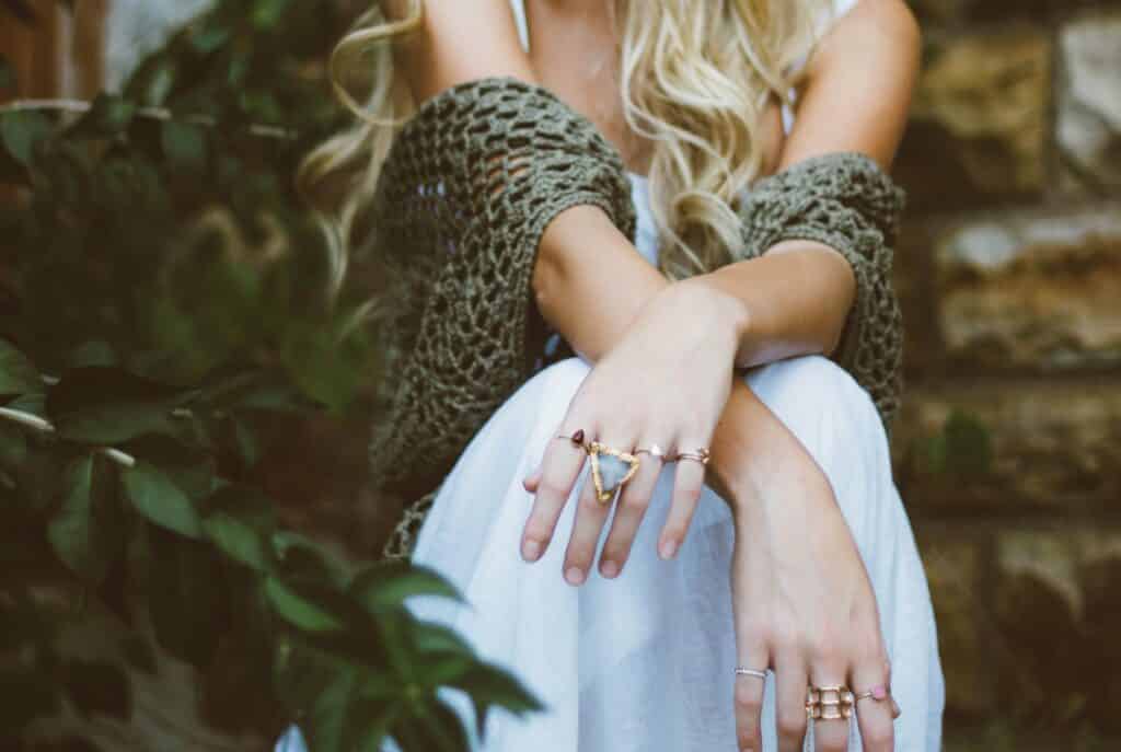 Saypaloma Rings on girls hand sat in greenery
