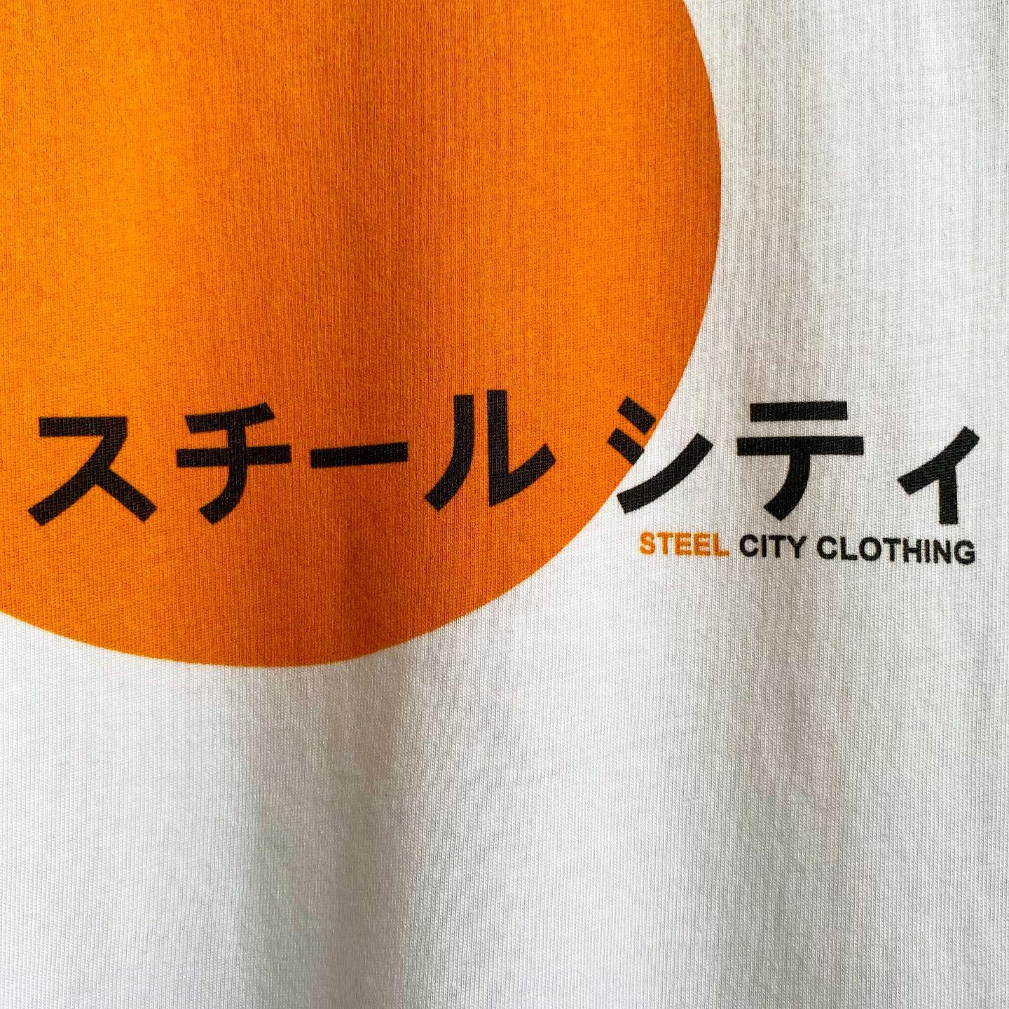 Steel city jumper in Japanese with an orange circle